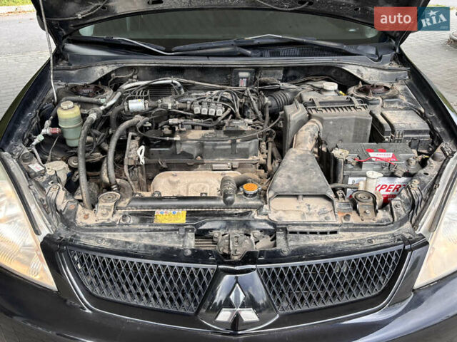 Чорний Міцубісі Lancer, об'ємом двигуна 1.6 л та пробігом 173 тис. км за 3700 $, фото 20 на Automoto.ua