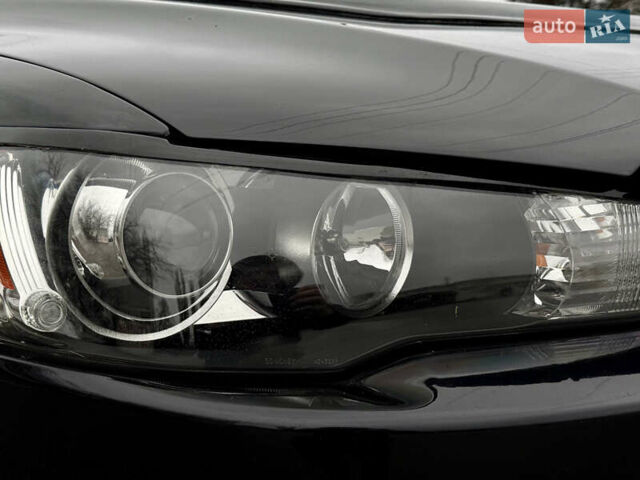 Черный Мицубиси Лансер, объемом двигателя 2 л и пробегом 215 тыс. км за 5500 $, фото 11 на Automoto.ua