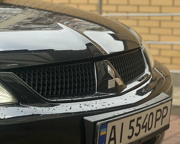 Черный Мицубиси Лансер, объемом двигателя 1.6 л и пробегом 211 тыс. км за 5700 $, фото 12 на Automoto.ua