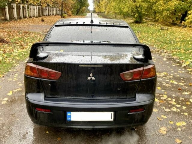 Черный Мицубиси Лансер, объемом двигателя 2 л и пробегом 280 тыс. км за 4600 $, фото 3 на Automoto.ua