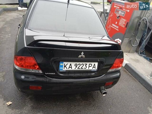 Черный Мицубиси Лансер, объемом двигателя 1.58 л и пробегом 180 тыс. км за 4500 $, фото 3 на Automoto.ua