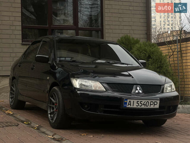 Черный Мицубиси Лансер, объемом двигателя 1.6 л и пробегом 211 тыс. км за 5700 $, фото 37 на Automoto.ua