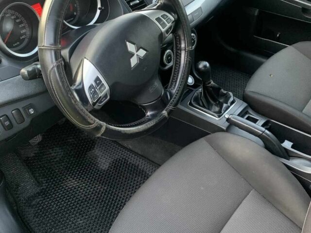 Черный Мицубиси Лансер, объемом двигателя 2 л и пробегом 208 тыс. км за 4300 $, фото 2 на Automoto.ua