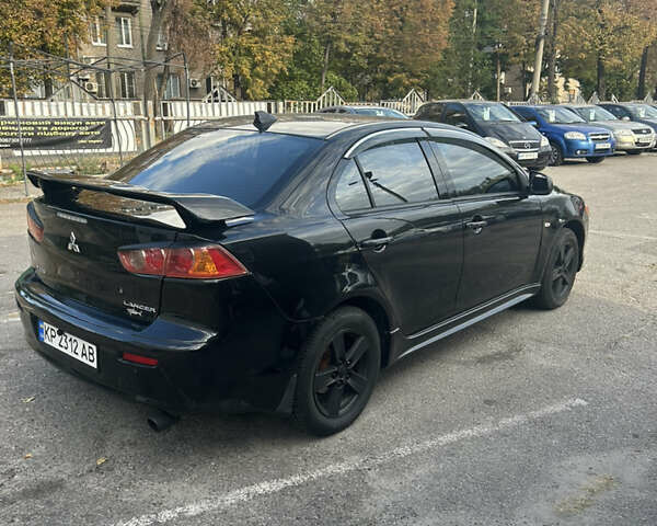 Черный Мицубиси Лансер, объемом двигателя 2 л и пробегом 208 тыс. км за 6500 $, фото 8 на Automoto.ua