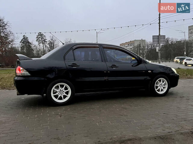 Чорний Міцубісі Lancer, об'ємом двигуна 1.6 л та пробігом 303 тис. км за 4350 $, фото 11 на Automoto.ua