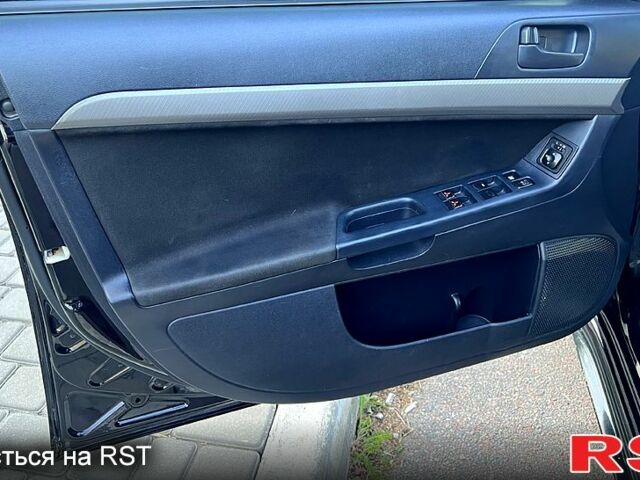 Черный Мицубиси Лансер, объемом двигателя 2 л и пробегом 216 тыс. км за 7500 $, фото 5 на Automoto.ua