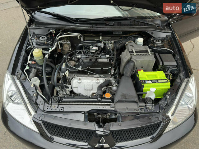 Чорний Міцубісі Lancer, об'ємом двигуна 1.58 л та пробігом 173 тис. км за 4700 $, фото 19 на Automoto.ua