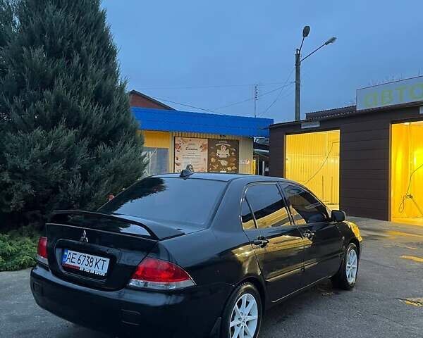 Черный Мицубиси Лансер, объемом двигателя 1.6 л и пробегом 249 тыс. км за 5000 $, фото 3 на Automoto.ua