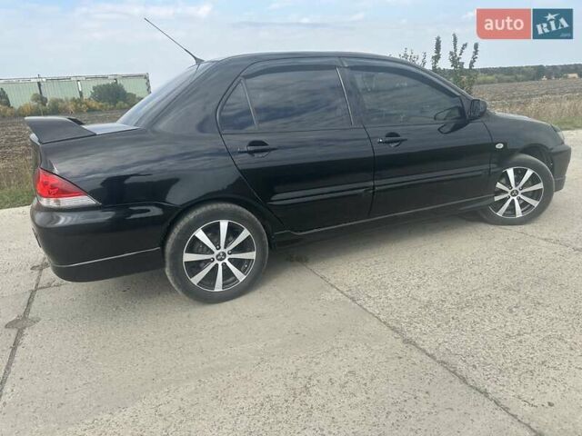 Чорний Міцубісі Lancer, об'ємом двигуна 1.6 л та пробігом 310 тис. км за 5100 $, фото 15 на Automoto.ua