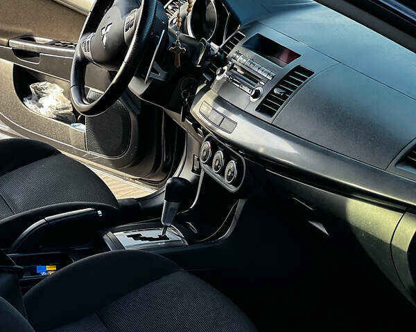 Черный Мицубиси Лансер, объемом двигателя 2 л и пробегом 333 тыс. км за 7300 $, фото 1 на Automoto.ua