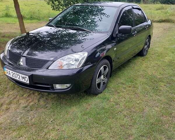 Черный Мицубиси Лансер, объемом двигателя 1.6 л и пробегом 210 тыс. км за 5500 $, фото 1 на Automoto.ua