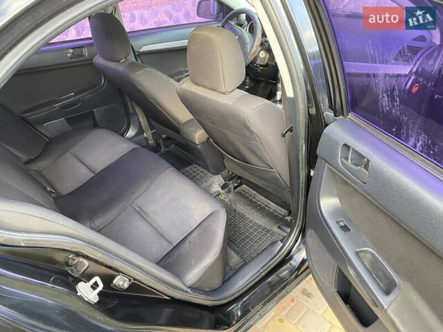 Чорний Міцубісі Lancer, об'ємом двигуна 1.5 л та пробігом 240 тис. км за 5650 $, фото 17 на Automoto.ua