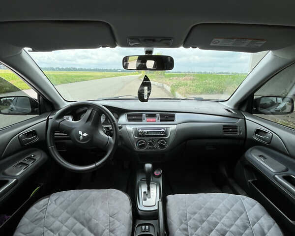Чорний Міцубісі Lancer, об'ємом двигуна 1.59 л та пробігом 150 тис. км за 5500 $, фото 1 на Automoto.ua