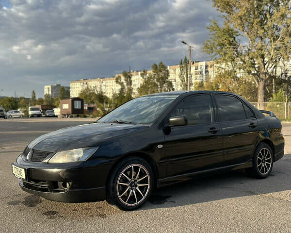 Чорний Міцубісі Lancer, об'ємом двигуна 2 л та пробігом 280 тис. км за 4600 $, фото 6 на Automoto.ua