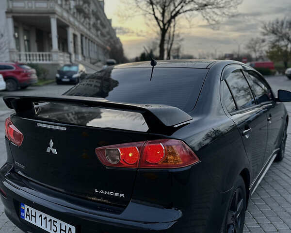 Черный Мицубиси Лансер, объемом двигателя 2 л и пробегом 245 тыс. км за 6200 $, фото 11 на Automoto.ua