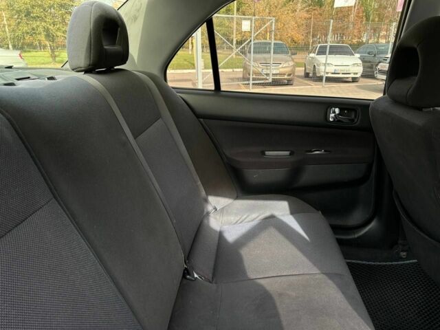 Мицубиси Лансер 2007 в Кривом Роге на Automoto.ua Черный Мицубиси Лансер, объемом двигателя 2 л и пробегом 143 тыс. км за 5400 $, фото 17 на Automoto.ua