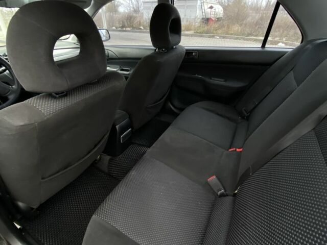 Черный Мицубиси Лансер, объемом двигателя 1.6 л и пробегом 263 тыс. км за 2900 $, фото 10 на Automoto.ua