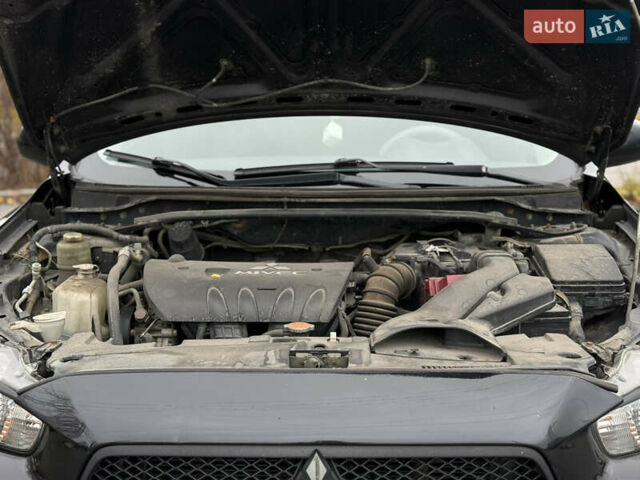 Черный Мицубиси Лансер, объемом двигателя 2 л и пробегом 215 тыс. км за 5500 $, фото 16 на Automoto.ua