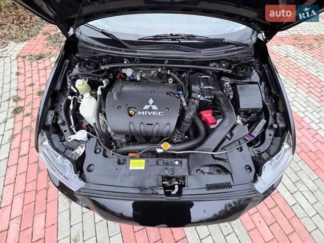 Черный Мицубиси Лансер, объемом двигателя 2 л и пробегом 217 тыс. км за 5500 $, фото 11 на Automoto.ua