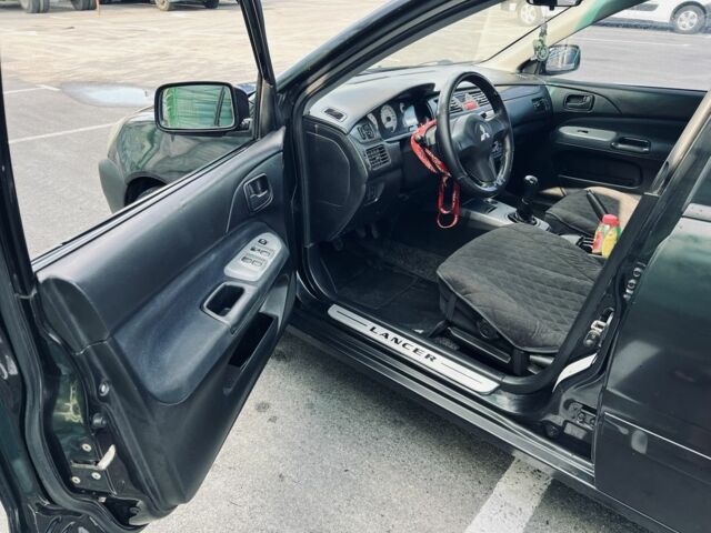 Чорний Міцубісі Lancer, об'ємом двигуна 1.6 л та пробігом 228 тис. км за 3300 $, фото 6 на Automoto.ua