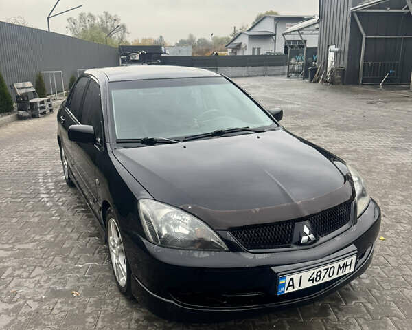 Чорний Міцубісі Lancer, об'ємом двигуна 2 л та пробігом 210 тис. км за 5500 $, фото 51 на Automoto.ua