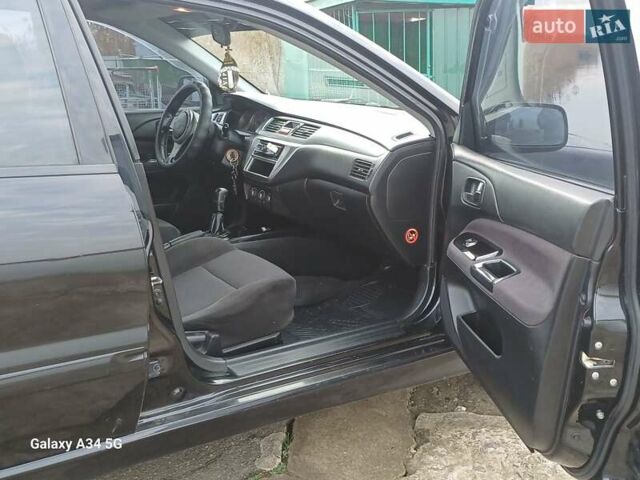 Черный Мицубиси Лансер, объемом двигателя 2 л и пробегом 286 тыс. км за 4000 $, фото 11 на Automoto.ua