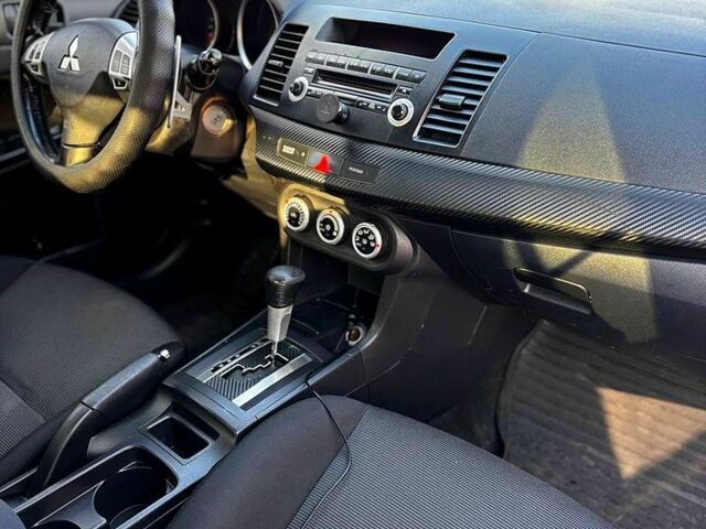 Черный Мицубиси Лансер, объемом двигателя 2 л и пробегом 224 тыс. км за 7000 $, фото 2 на Automoto.ua