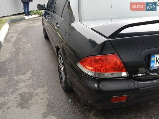 Черный Мицубиси Лансер, объемом двигателя 1.58 л и пробегом 180 тыс. км за 4500 $, фото 4 на Automoto.ua