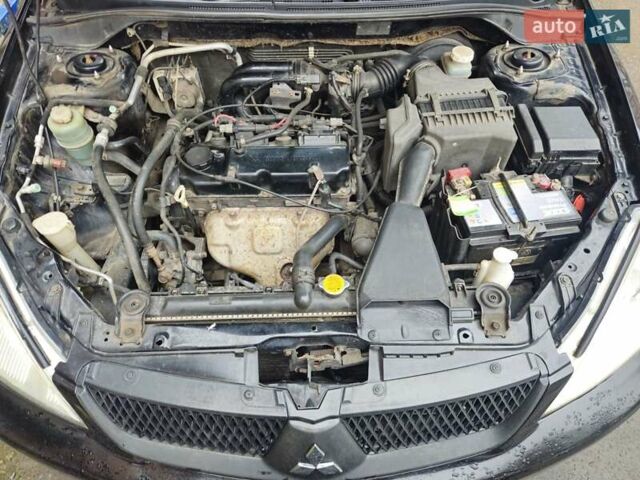 Чорний Міцубісі Lancer, об'ємом двигуна 1.59 л та пробігом 180 тис. км за 4999 $, фото 19 на Automoto.ua