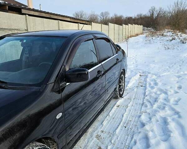 Чорний Міцубісі Lancer, об'ємом двигуна 1.6 л та пробігом 240 тис. км за 3500 $, фото 6 на Automoto.ua