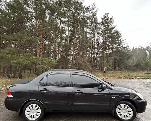 Черный Мицубиси Лансер, объемом двигателя 1.58 л и пробегом 254 тыс. км за 5000 $, фото 5 на Automoto.ua