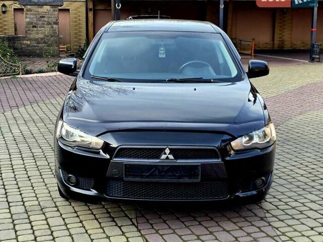 Чорний Міцубісі Lancer, об'ємом двигуна 2 л та пробігом 260 тис. км за 6555 $, фото 5 на Automoto.ua