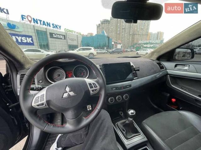 Черный Мицубиси Лансер, объемом двигателя 2 л и пробегом 246 тыс. км за 7500 $, фото 14 на Automoto.ua
