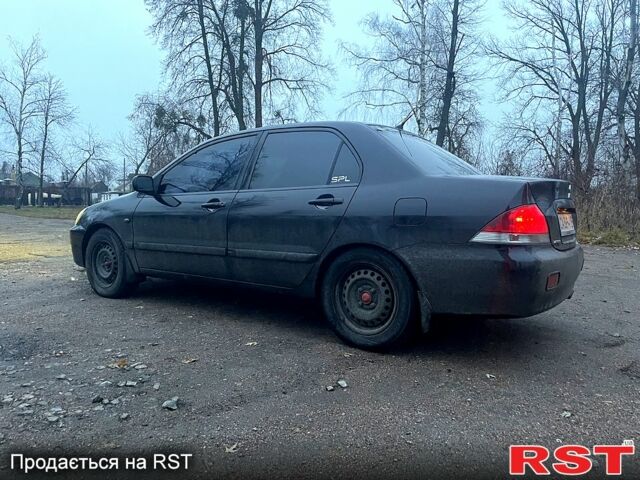 Чорний Міцубісі Lancer, об'ємом двигуна 1.6 л та пробігом 201 тис. км за 4000 $, фото 7 на Automoto.ua