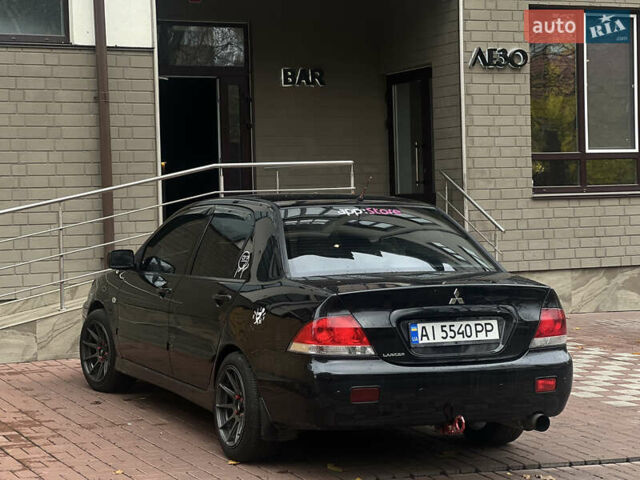 Черный Мицубиси Лансер, объемом двигателя 1.6 л и пробегом 211 тыс. км за 5700 $, фото 9 на Automoto.ua