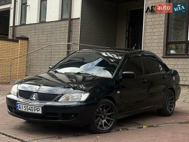 Черный Мицубиси Лансер, объемом двигателя 1.6 л и пробегом 211 тыс. км за 5700 $, фото 4 на Automoto.ua