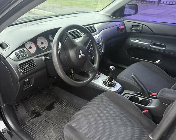 Чорний Міцубісі Lancer, об'ємом двигуна 1.58 л та пробігом 256 тис. км за 3700 $, фото 12 на Automoto.ua