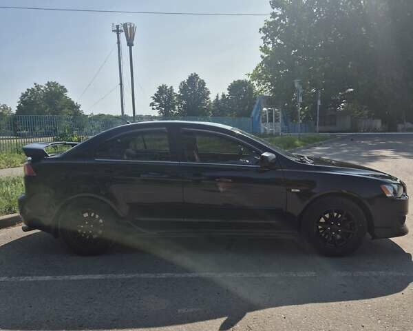 Чорний Міцубісі Lancer, об'ємом двигуна 2 л та пробігом 243 тис. км за 6600 $, фото 6 на Automoto.ua