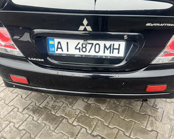 Чорний Міцубісі Lancer, об'ємом двигуна 2 л та пробігом 210 тис. км за 5500 $, фото 10 на Automoto.ua