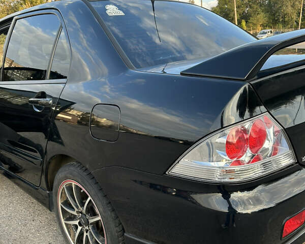 Чорний Міцубісі Lancer, об'ємом двигуна 2 л та пробігом 280 тис. км за 4600 $, фото 24 на Automoto.ua
