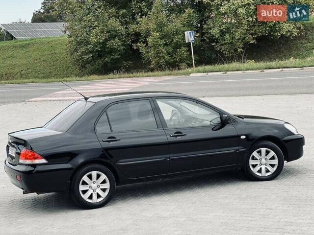 Чорний Міцубісі Lancer, об'ємом двигуна 1.6 л та пробігом 243 тис. км за 4950 $, фото 29 на Automoto.ua