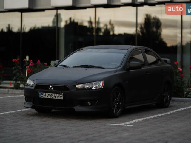 Чорний Міцубісі Lancer, об'ємом двигуна 2 л та пробігом 203 тис. км за 7000 $, фото 4 на Automoto.ua
