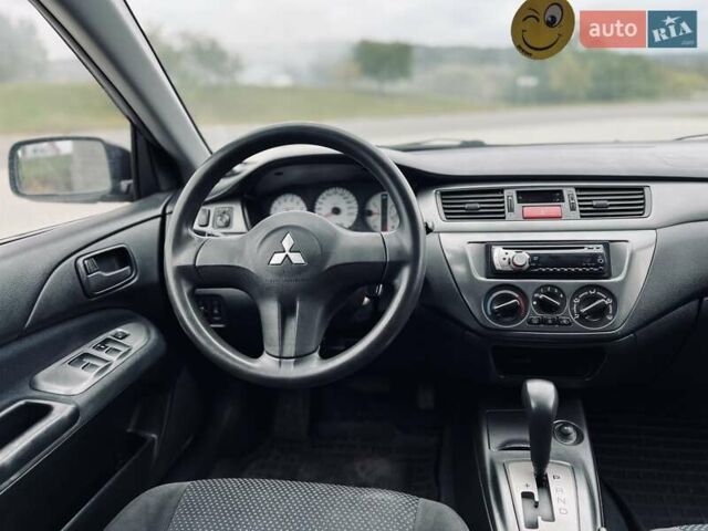 Чорний Міцубісі Lancer, об'ємом двигуна 1.6 л та пробігом 243 тис. км за 4950 $, фото 51 на Automoto.ua