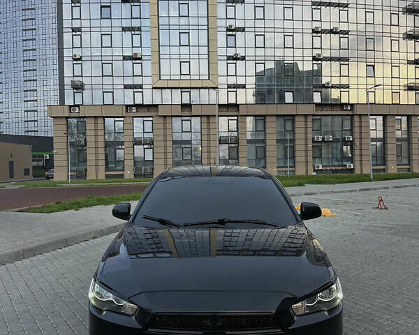 Черный Мицубиси Лансер, объемом двигателя 2 л и пробегом 245 тыс. км за 6200 $, фото 3 на Automoto.ua