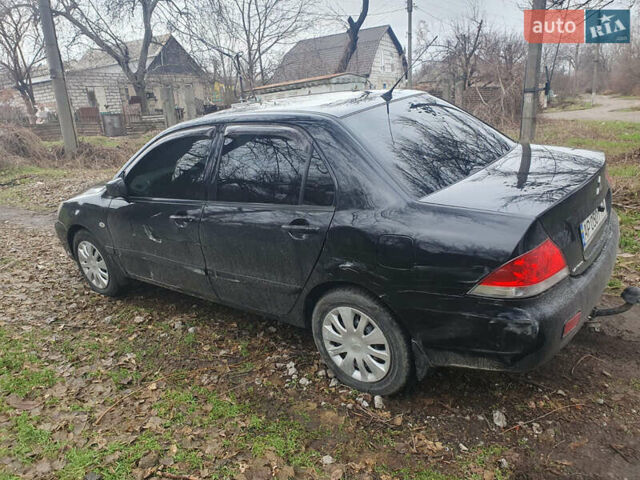 Чорний Міцубісі Lancer, об'ємом двигуна 1.58 л та пробігом 173 тис. км за 5099 $, фото 12 на Automoto.ua
