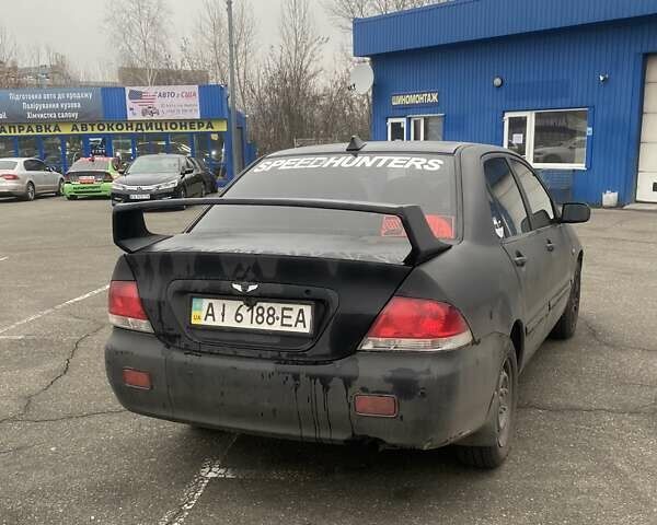 Черный Мицубиси Лансер, объемом двигателя 1.58 л и пробегом 263 тыс. км за 4000 $, фото 38 на Automoto.ua