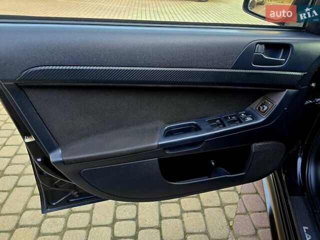 Чорний Міцубісі Lancer, об'ємом двигуна 2 л та пробігом 260 тис. км за 6555 $, фото 19 на Automoto.ua