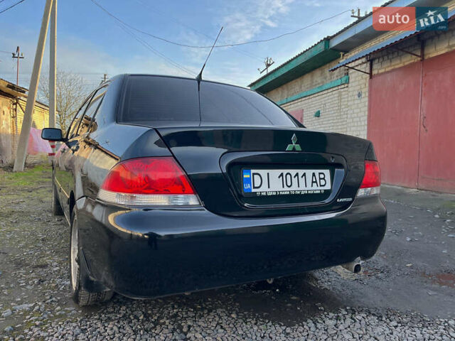 Черный Мицубиси Лансер, объемом двигателя 1.58 л и пробегом 156 тыс. км за 4599 $, фото 8 на Automoto.ua