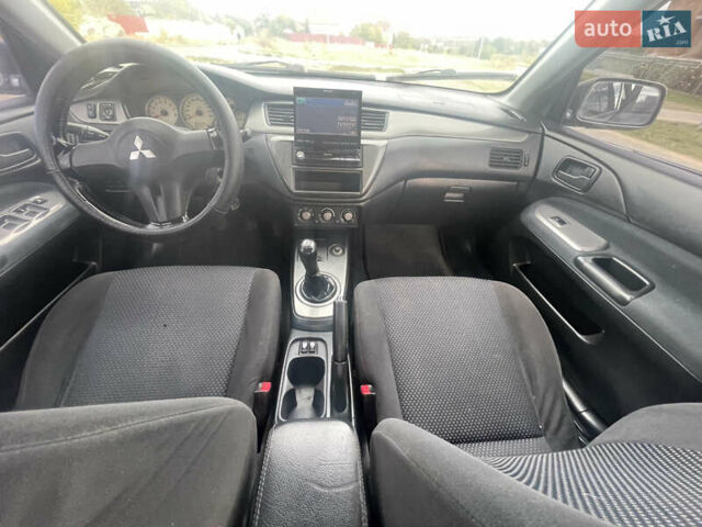 Чорний Міцубісі Lancer, об'ємом двигуна 1.6 л та пробігом 162 тис. км за 4650 $, фото 12 на Automoto.ua