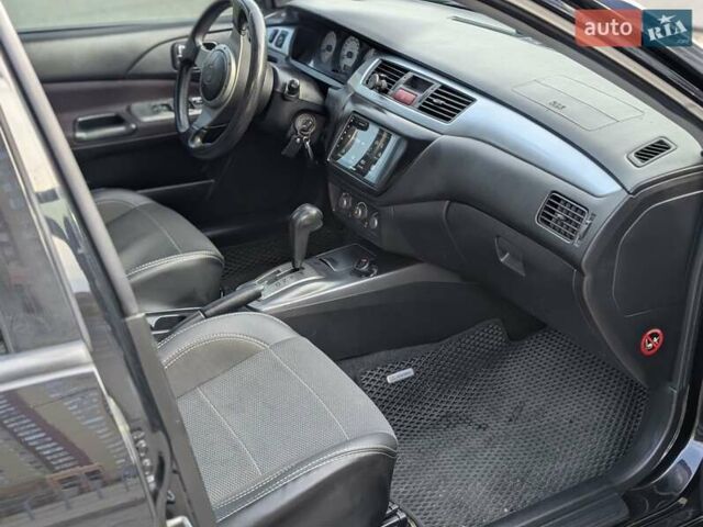 Чорний Міцубісі Lancer, об'ємом двигуна 2 л та пробігом 152 тис. км за 5500 $, фото 1 на Automoto.ua